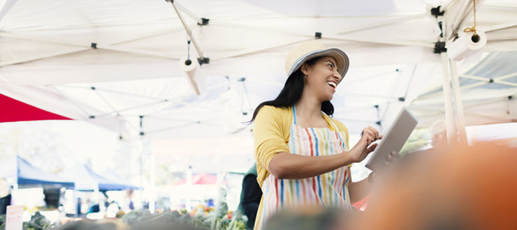 woman merchant at farmers market