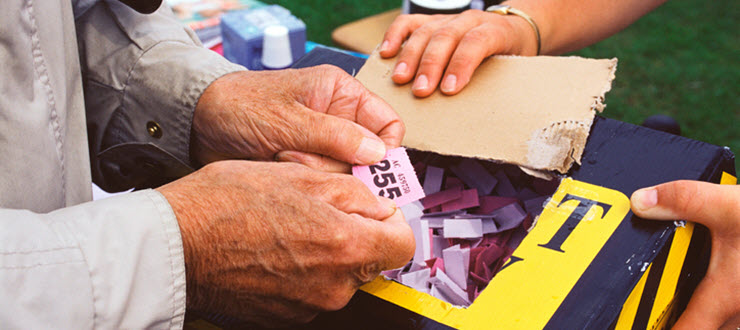 Man holding raffle tickets