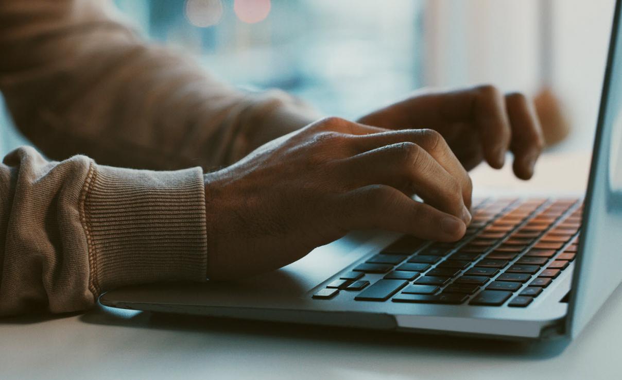 Man typing on laptop